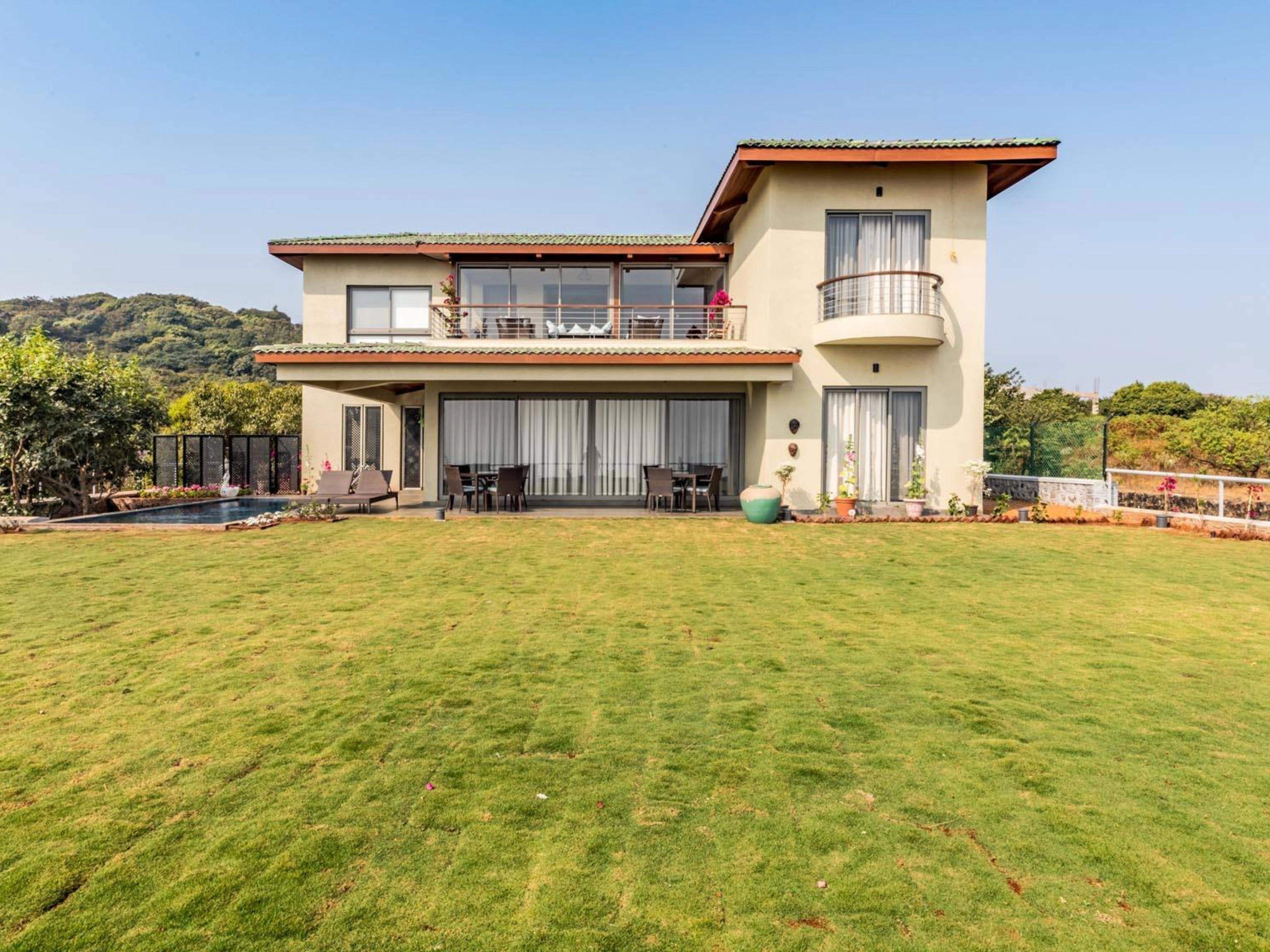 Elegant villa at Ramsukh Resort with a large lawn and scenic surroundings in Mahabaleshwar, Wai, Satara, Maharashtra.